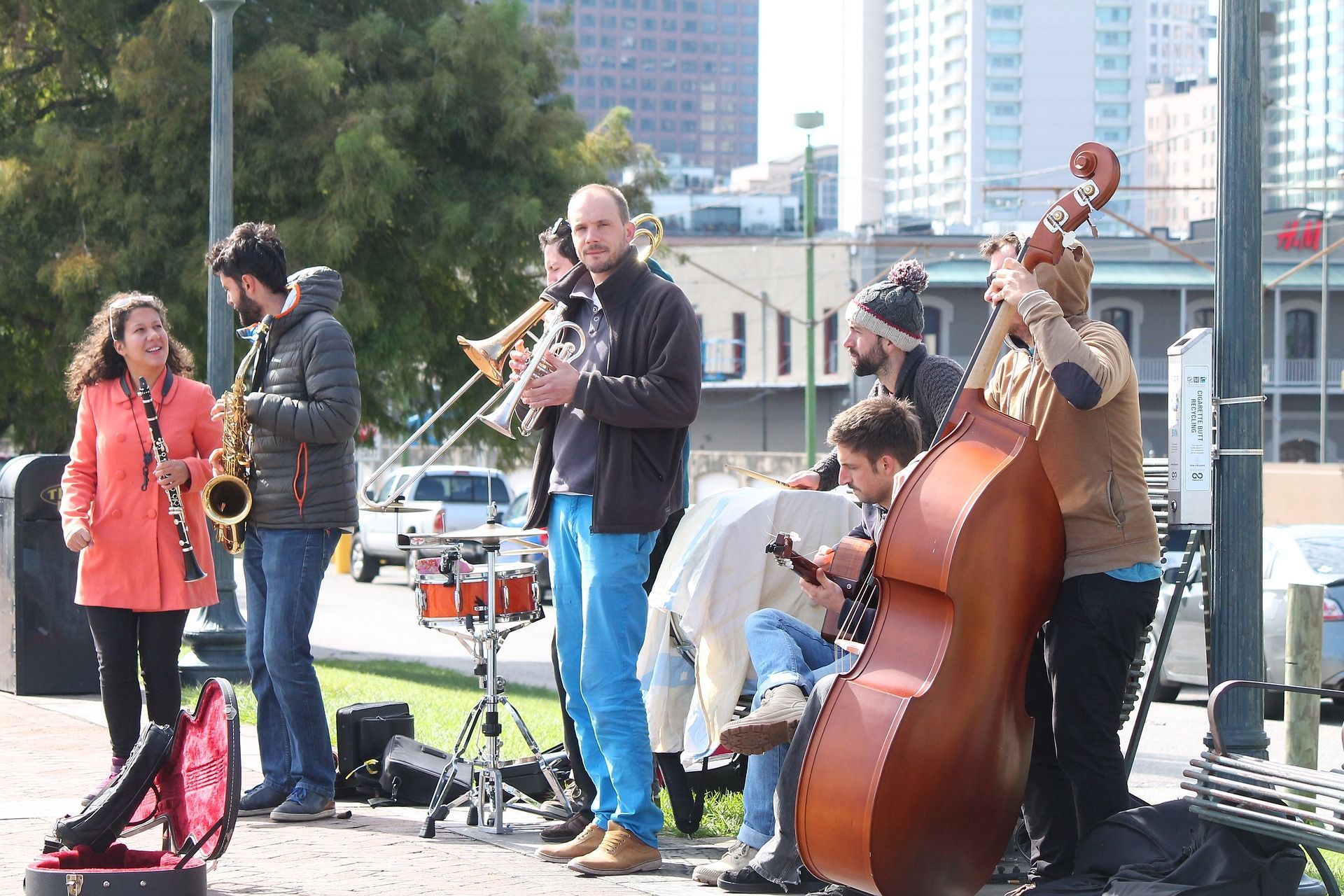 A group of people playing instruments including a double bass