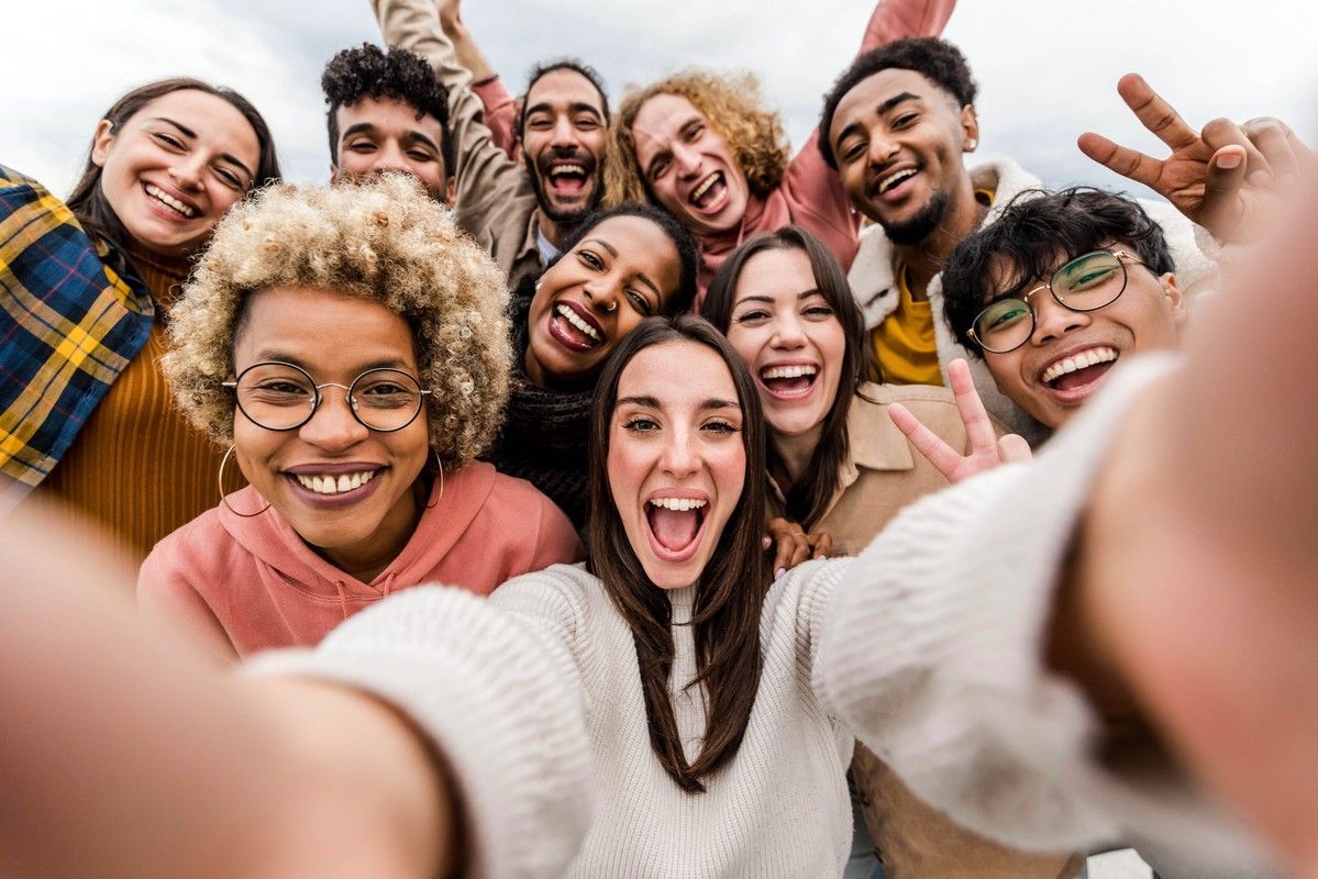 A group of people are taking a selfie together.