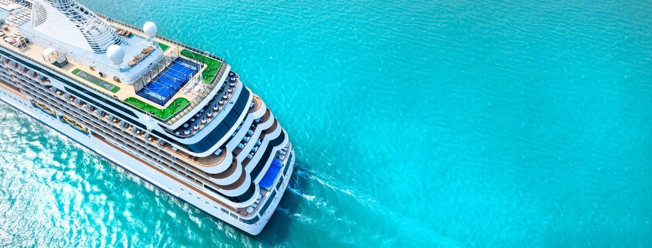 An aerial view of a cruise ship in the ocean.