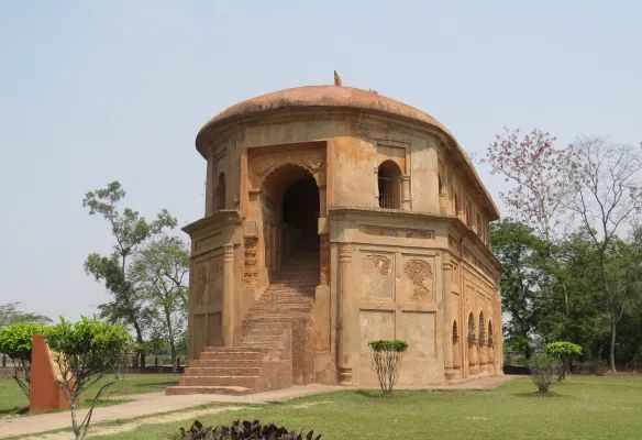 A very old building with stairs leading up to it Talatal Ghar Rangpur Palace