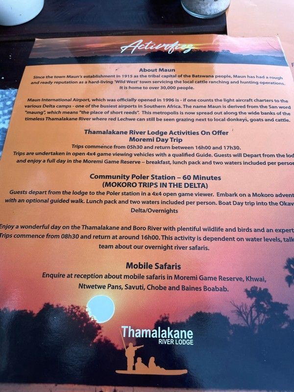A menu with a picture of a man in a canoe on it
