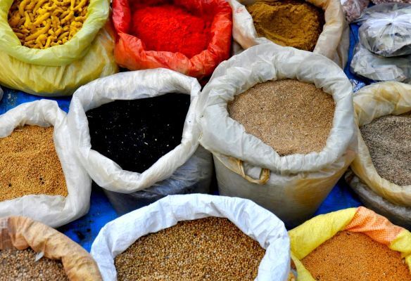 There are many different types of spices in the bags in the markets in India