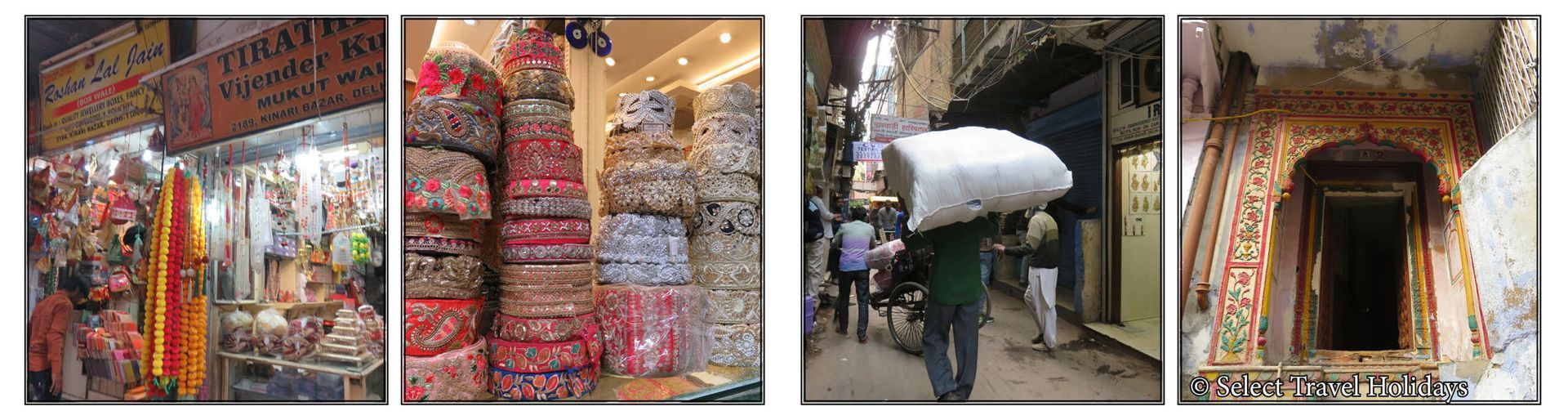 A man is carrying a large stack of boxes on his back in a market.