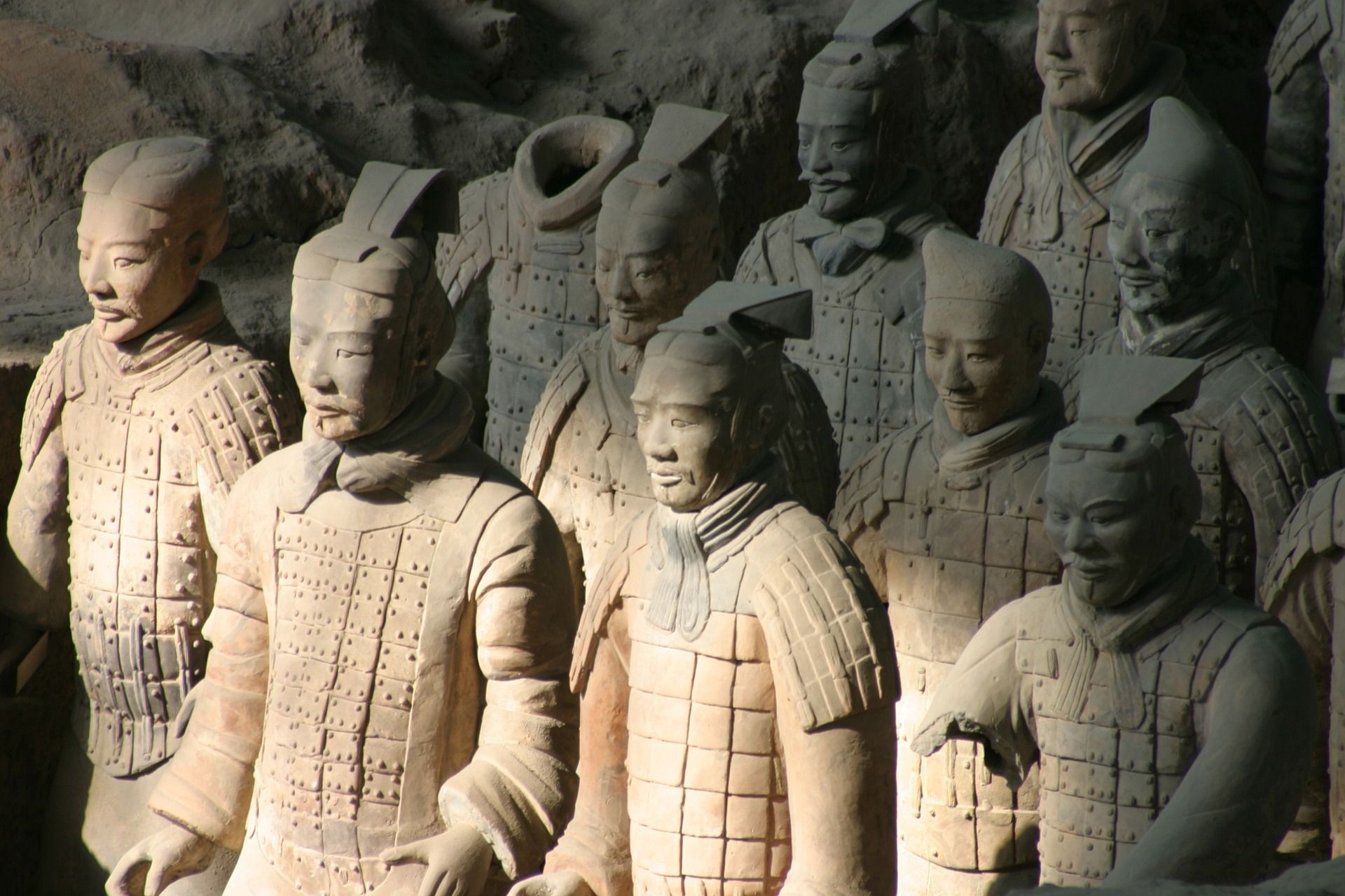 A group of statues of soldiers are lined up in a row at Xi'an, China