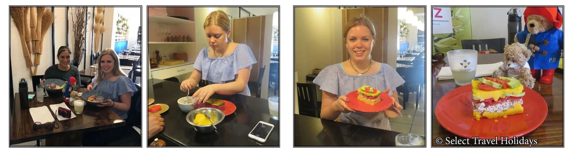 A woman is sitting at a table holding a plate of food.