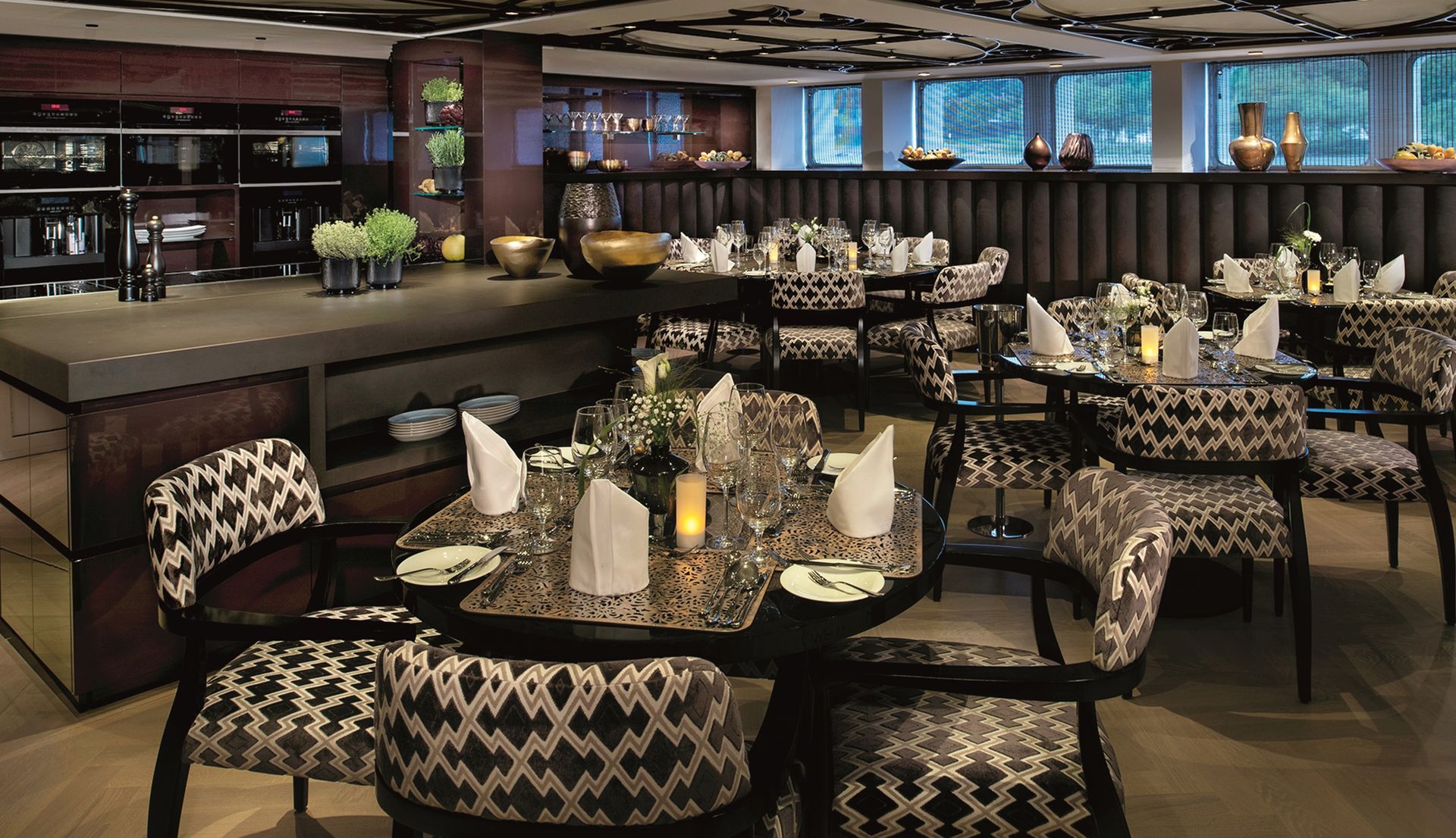 a restaurant with tables and chairs set up for dinner