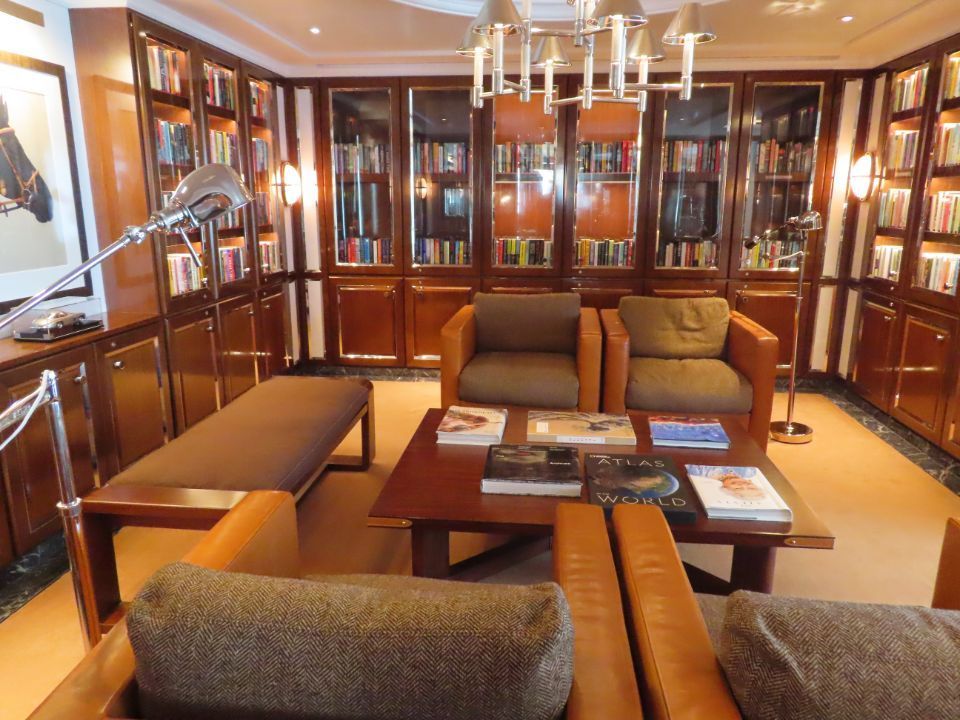 A living room filled with furniture and bookshelves