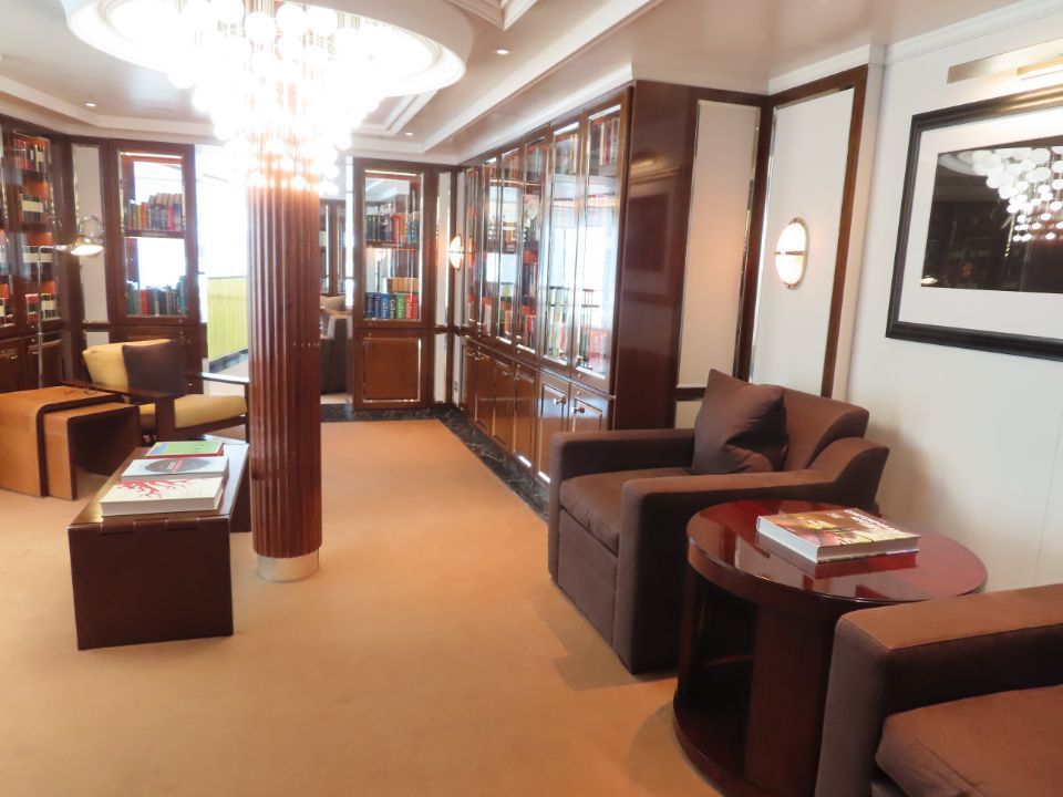 A living room filled with furniture and a chandelier