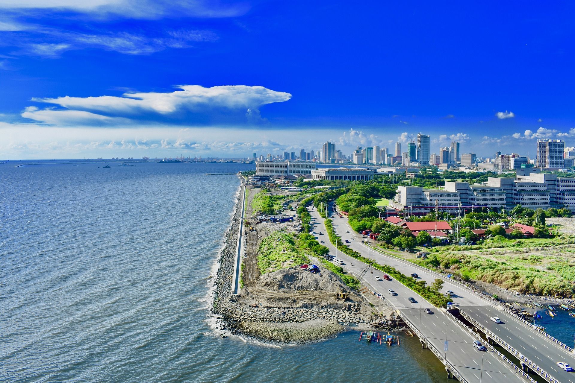 An aerial view of a city next to a body of water in Manilla