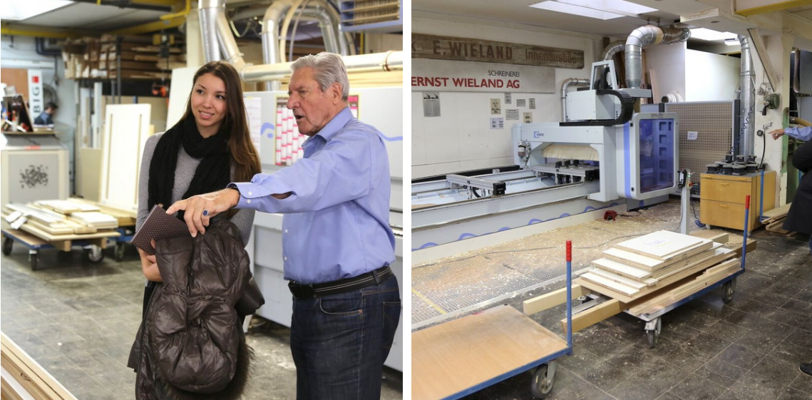 Ein Mann und eine Frau stehen nebeneinander in einer Holzwerkstatt.