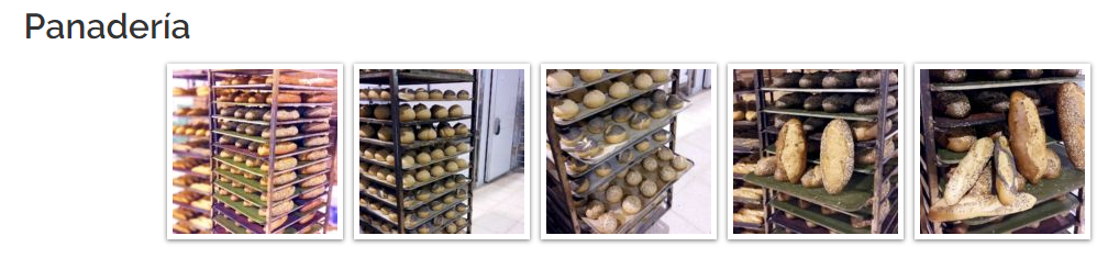 Estanterías de panadería repletas de panes y pasteles variados.