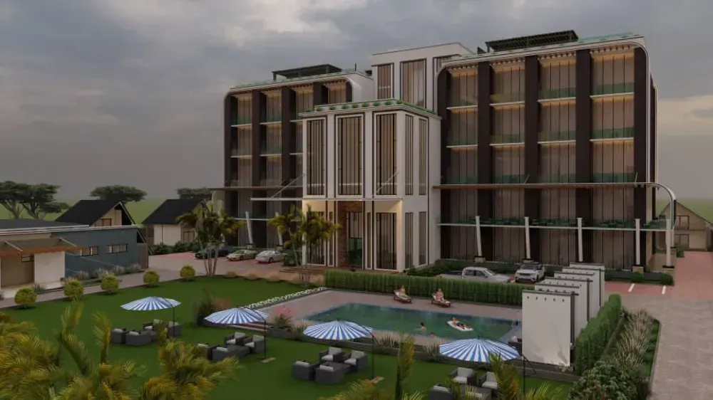 A large building with a swimming pool in front of it.