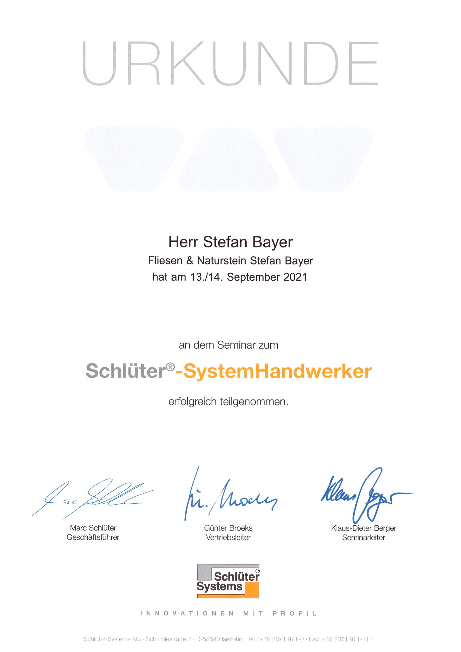 Ein Zertifikat mit Unterschriften darauf befindet sich auf einem weißen Hintergrund.