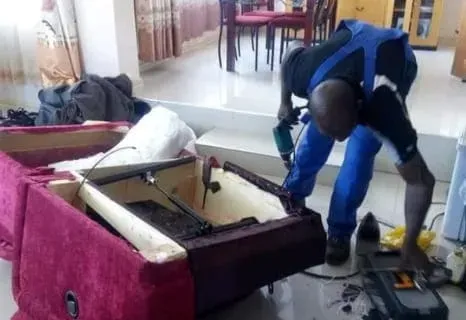A black and white photo of a kitchen with stainless steel ducts.