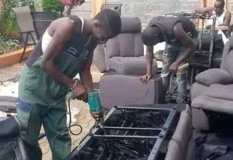 A man is working on the roof of a building.