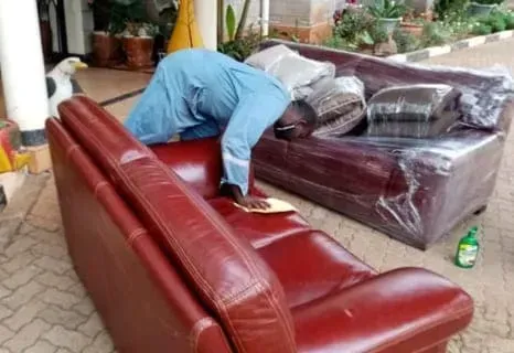 A room with a desk , chair , computer and servers.