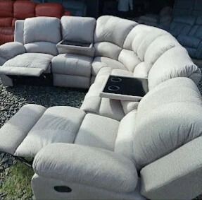 A group of people are looking at a laptop computer.