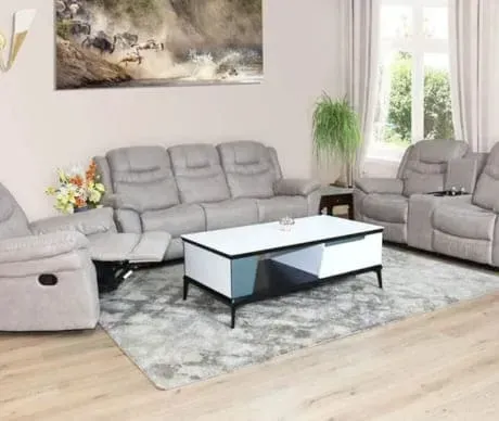 A living room filled with furniture and a coffee table.