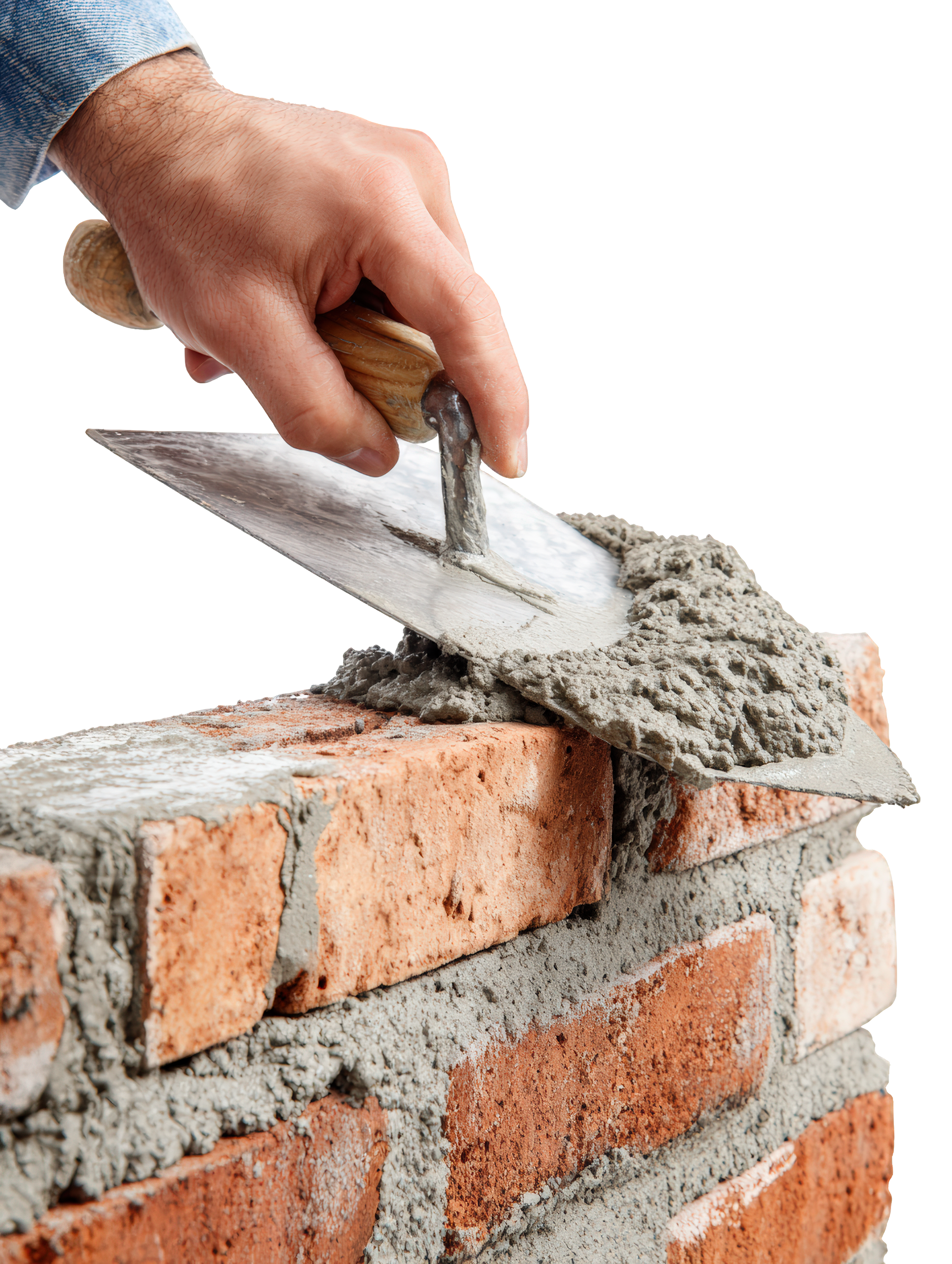 Application manuelle du mortier sur la brique à l'aide d'une truelle.