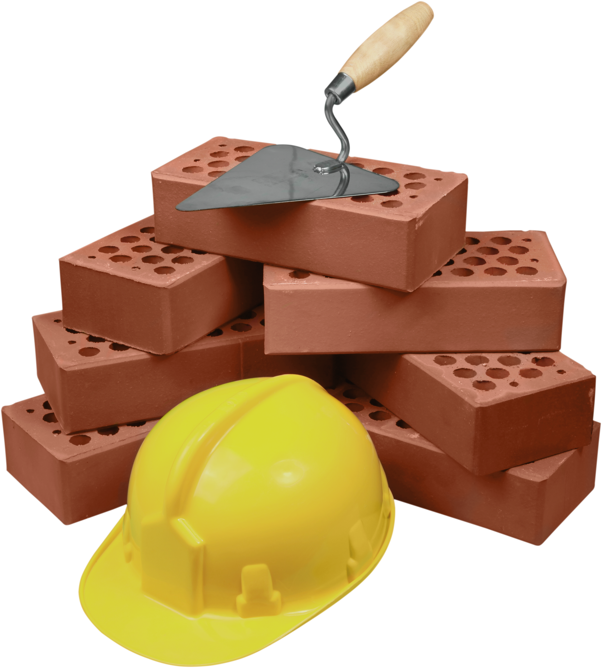 Un casque de chantier jaune à côté d'un tas de briques rouges et d'une truelle.
