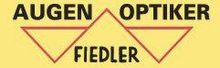 Das Logo von Augen Optiker Fiedler ist gelb und rot.