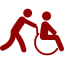 Una persona está empujando a otra persona en silla de ruedas.
