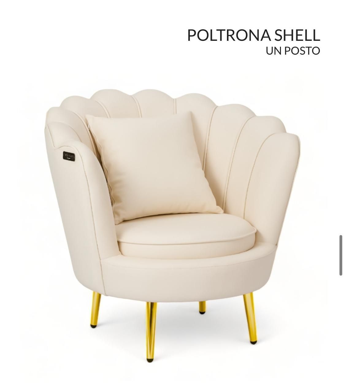 Una silla blanca con patas doradas y una almohada encima.