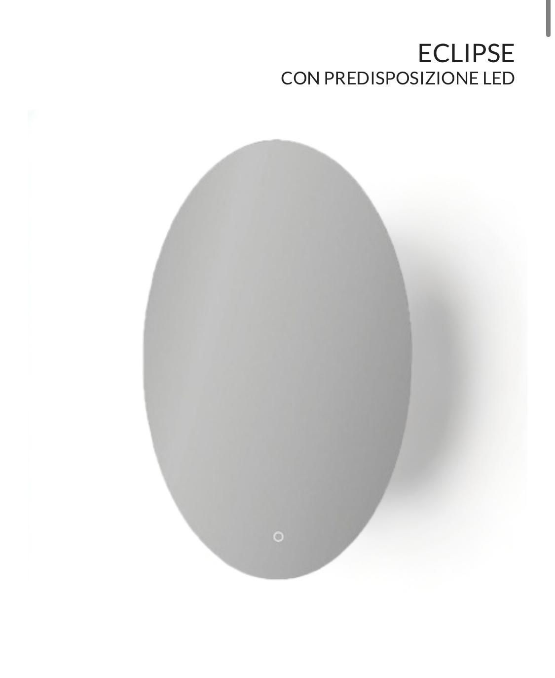 Un espejo ovalado gris con una luz.