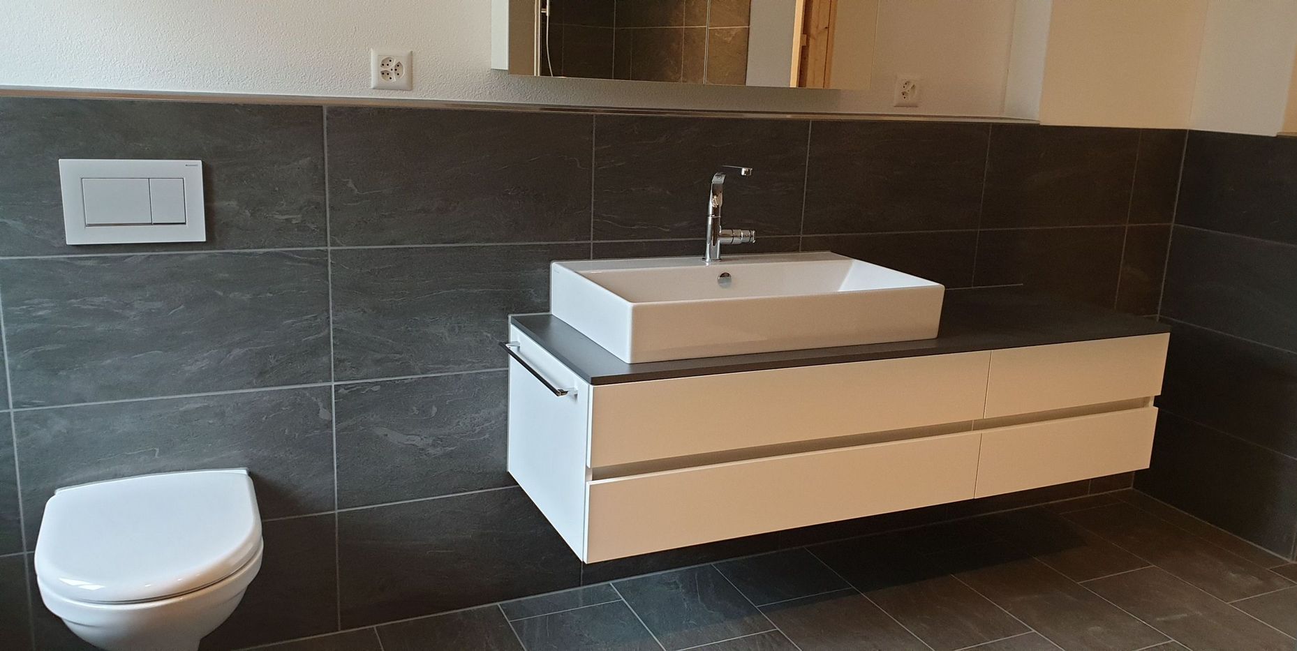 Rauner AG Plattenbeläge + Cheminéebau