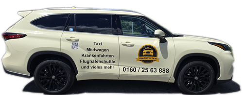 Taxi in cremefarbenem Ton mit schwarzen Rädern und Aufschrift: