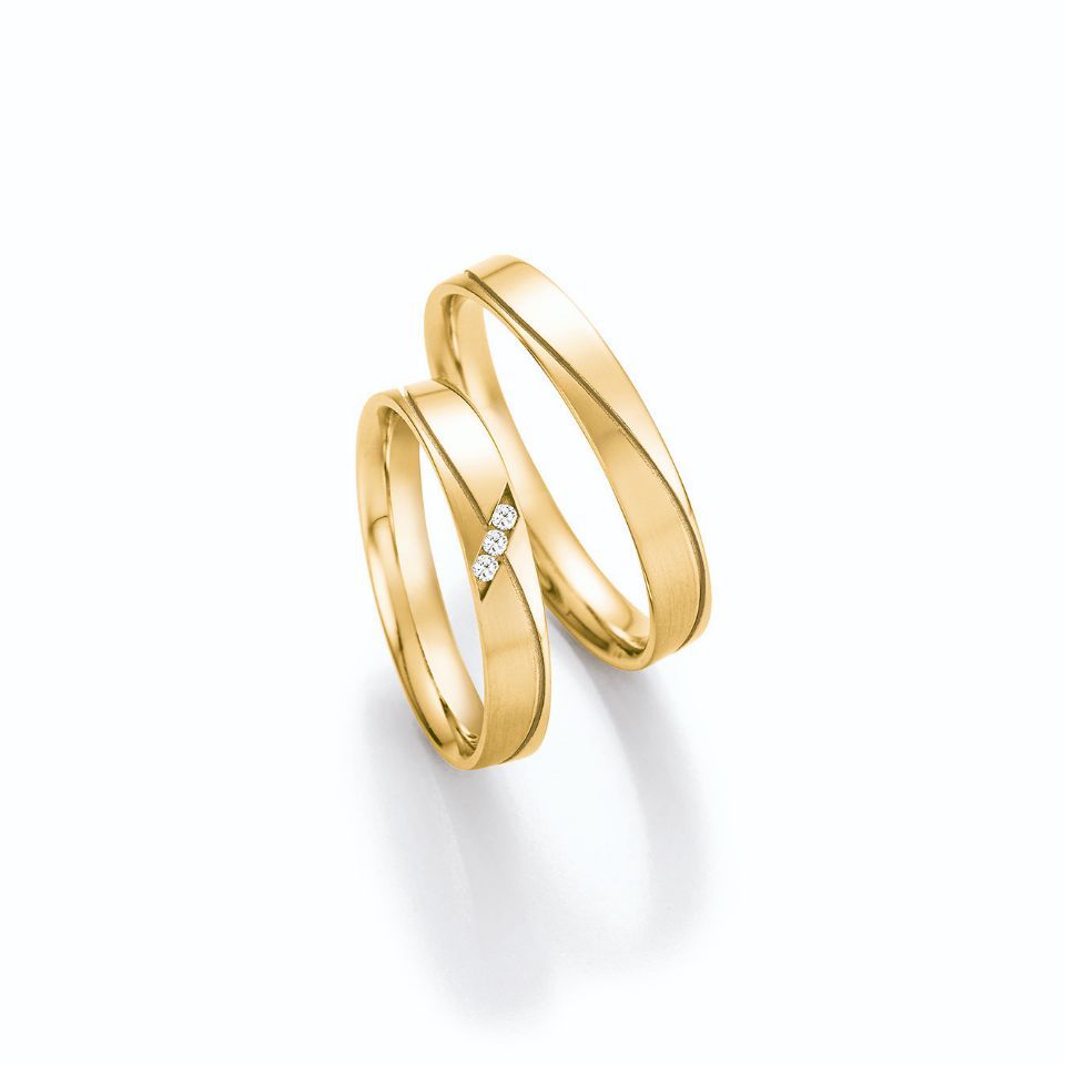 Einfarbige Hochzeitsringe in Gold mit Stein