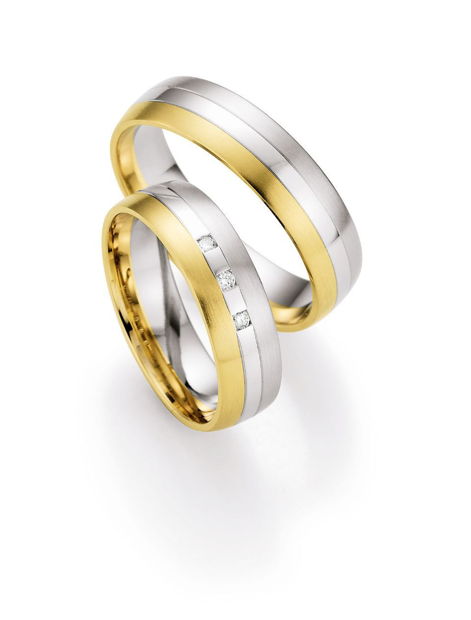 Hochzeitsringe in tricolor mit Gold, Weißgold und Silber mit Stein
