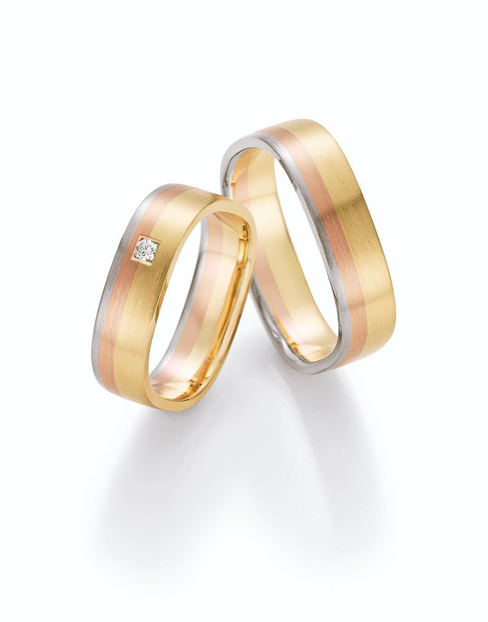 Hochzeitsringe in tricolor mit Gold, Roségold und Silber mit Stein