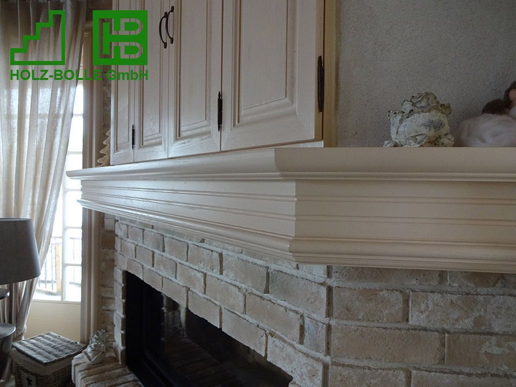 Ein Kamin mit Kaminsims von holz-bolz gmbh