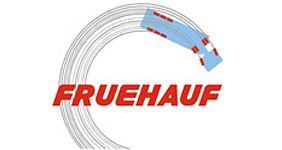 Un círculo blanco con la palabra fruehauf en él