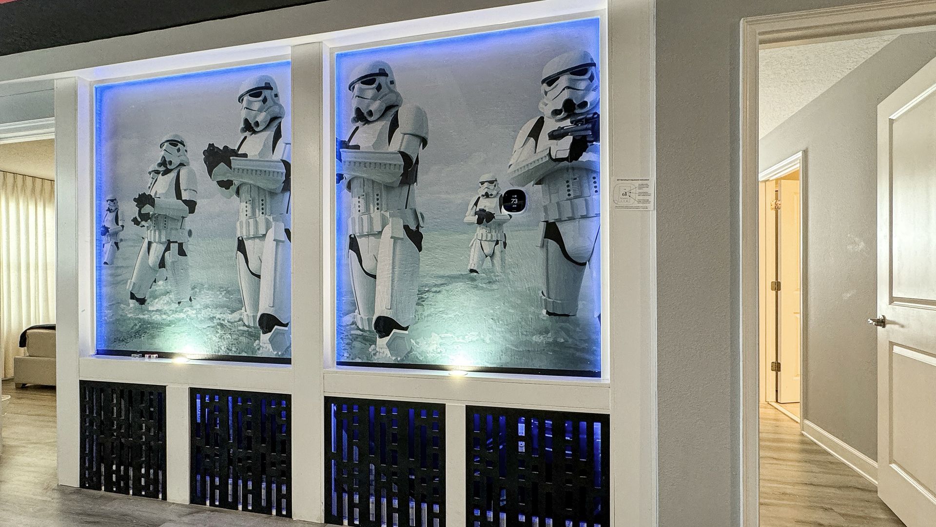 A room with a picture of stormtroopers on the wall.