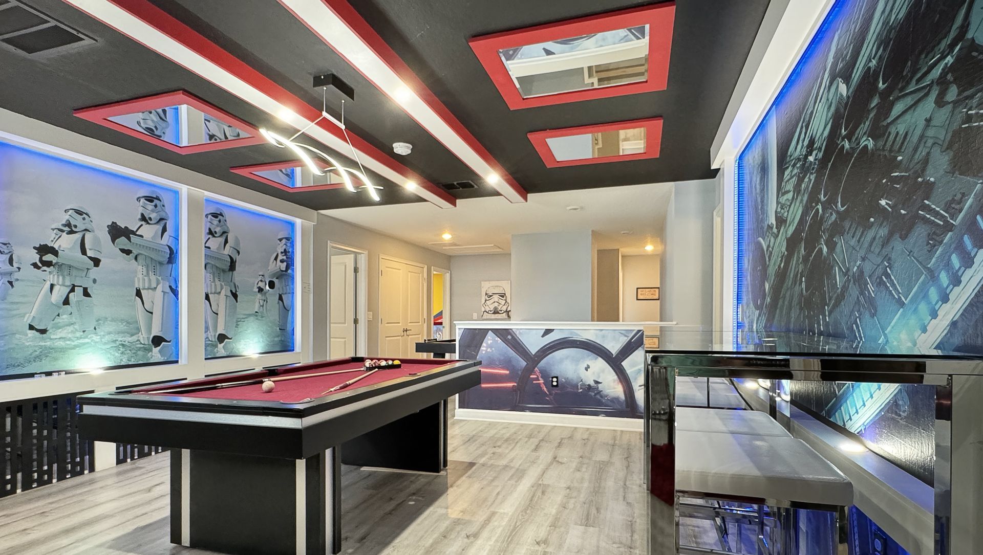 There is a pool table in the middle of the room.