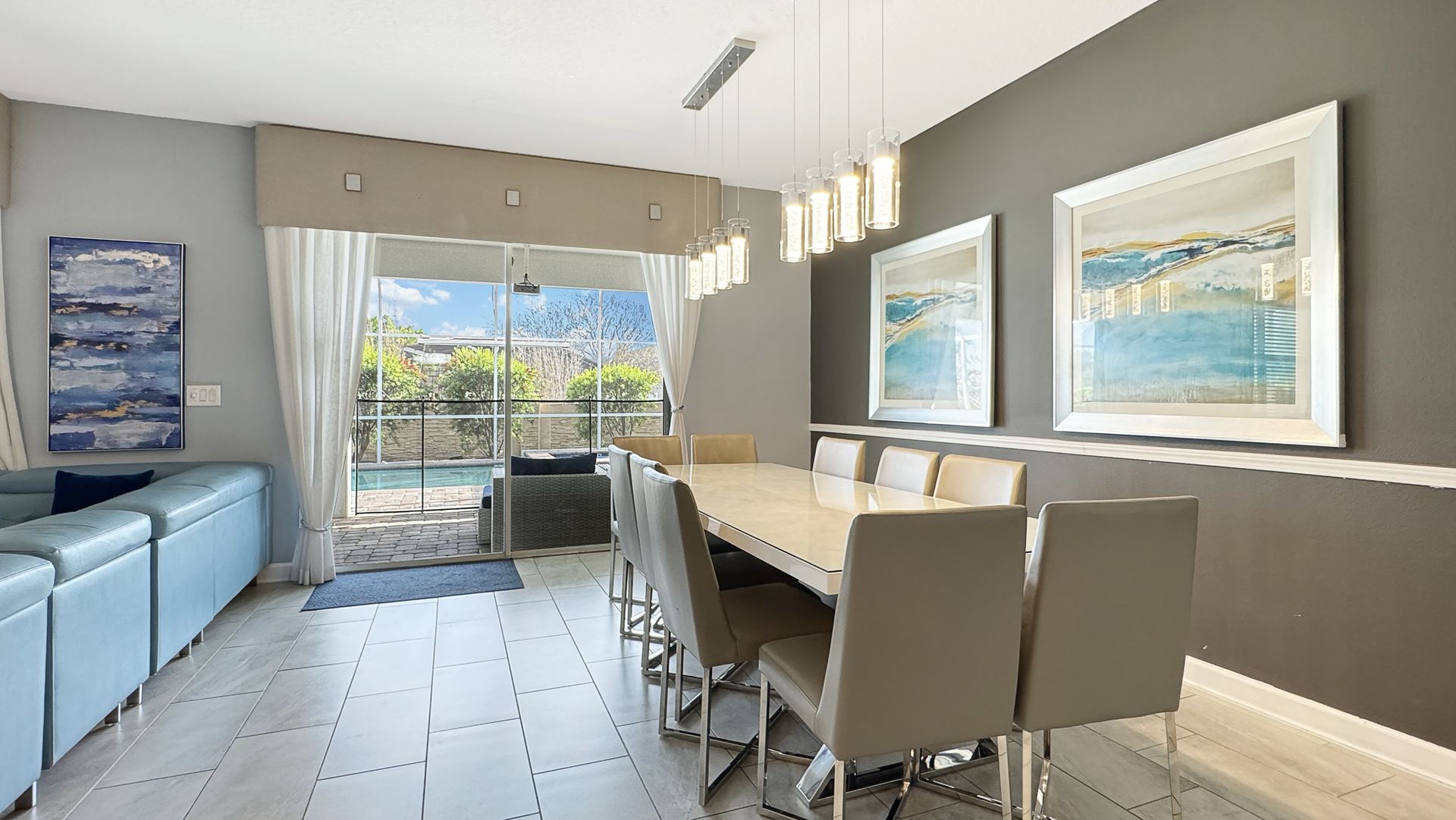 A living room with a dining room table and chairs