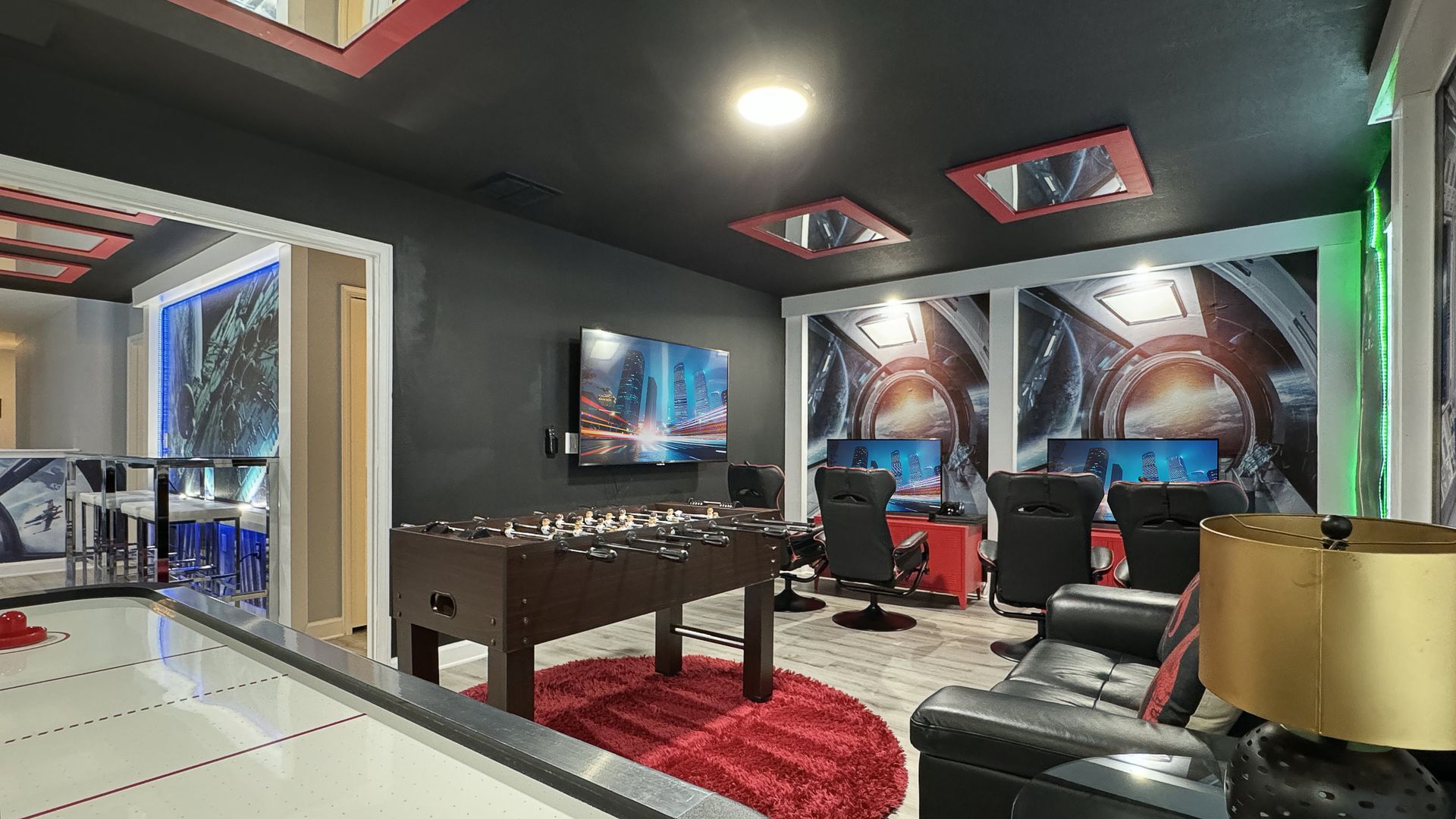 There is a foosball table in the middle of the room.