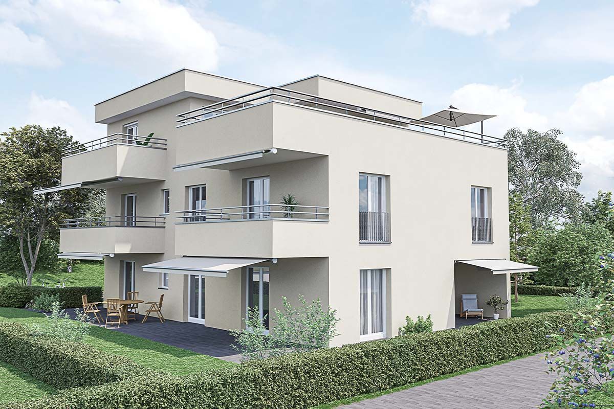 Ein weißes Haus mit vielen Fenstern und Balkonen