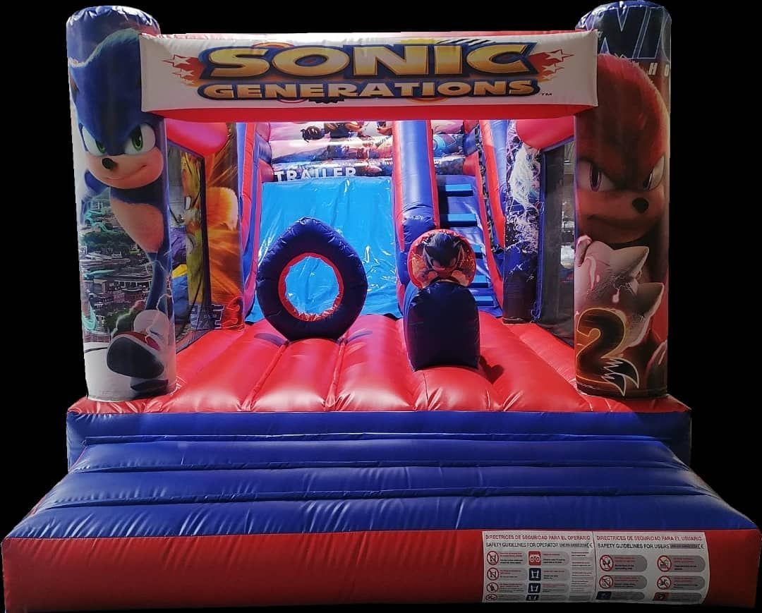 Una casa inflable rosa y violeta con bastones de caramelo y un tobogán.