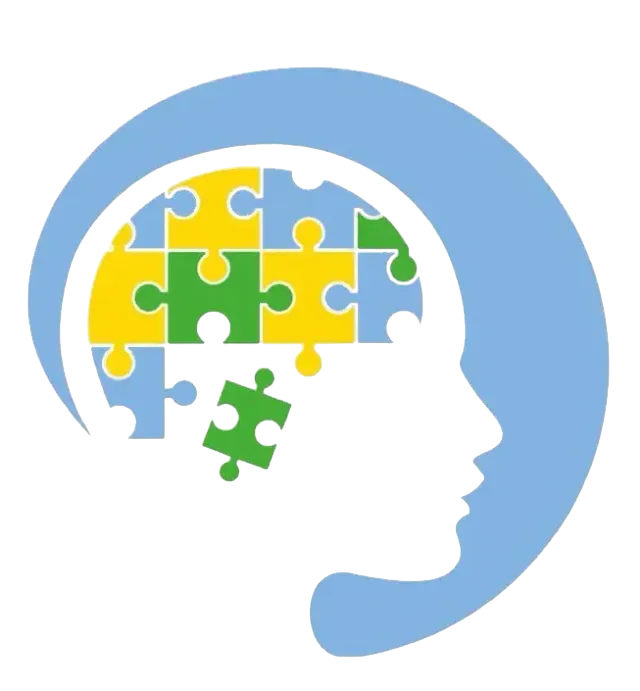 Silueta de una cabeza con un rompecabezas dentro, que representa el cerebro. Piezas de rompecabezas azules, verdes y amarillas.