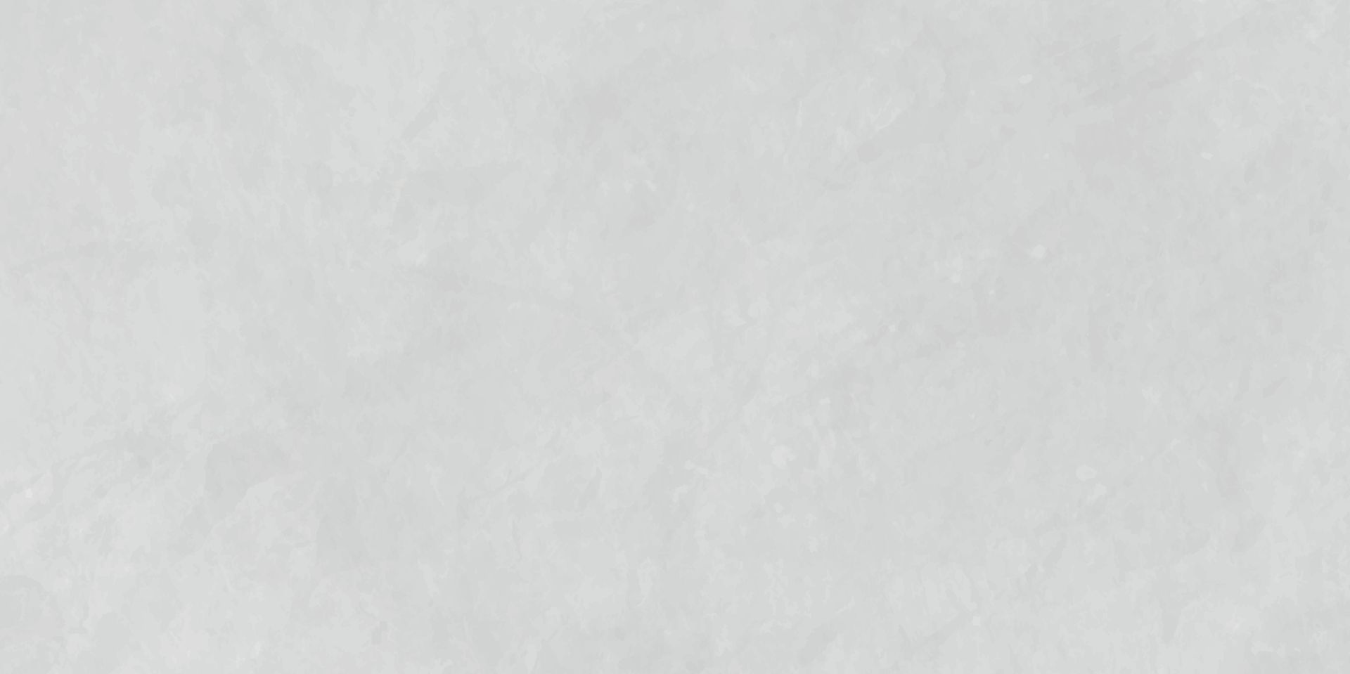 Une surface texturée, gris clair, avec de subtiles variations de tons.