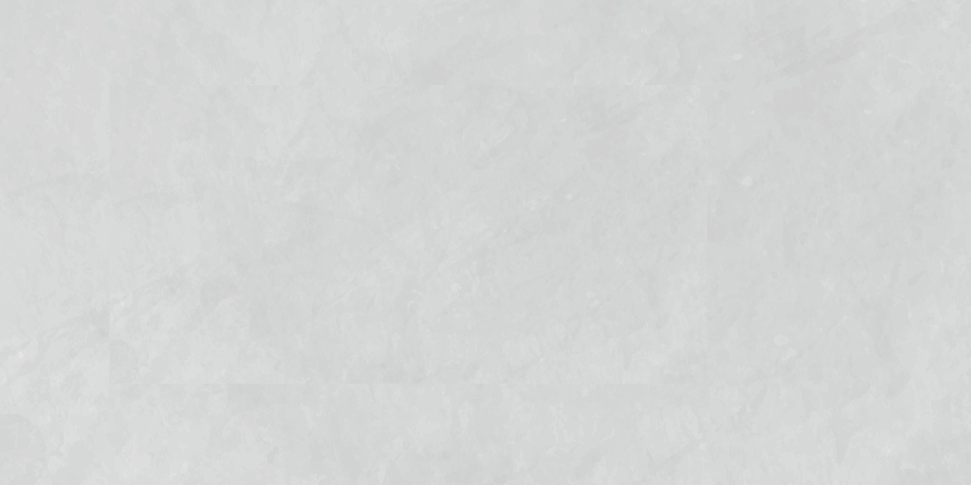 Surface blanche texturée avec de subtiles variations de tons, ressemblant à du plâtre ou à de la pierre.