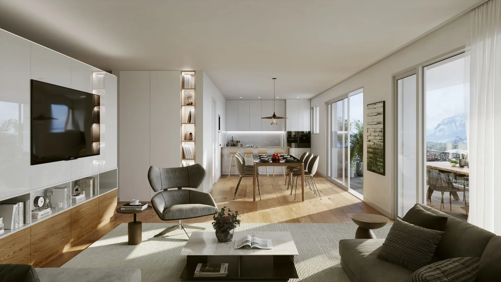 Ein Wohnzimmer mit Couch, Sessel, Tisch und Fernseher.