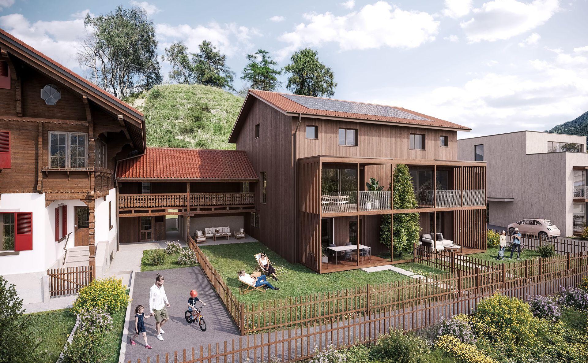 Holzbauten mit roten Dächern, Hof mit Menschen, die sich entspannen und spazieren gehen.
