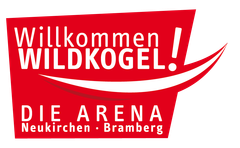 A red sign that says willkommen wildkogel die arena neukirchen bramberg