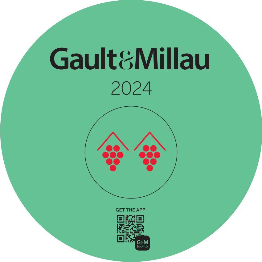 Ein grüner Kreis mit den Worten Gault & Millau 2024 darauf