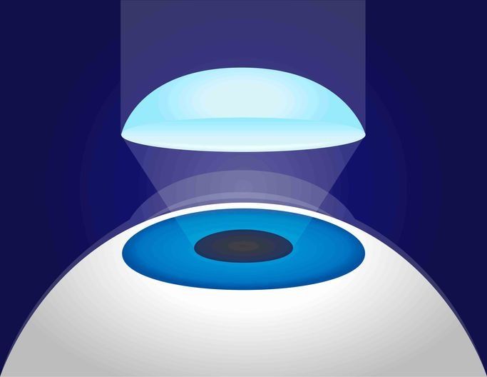 Una ilustración del ojo de una persona con una luz azul brillando sobre él.