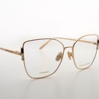 Un par de gafas encima de una mesa blanca.